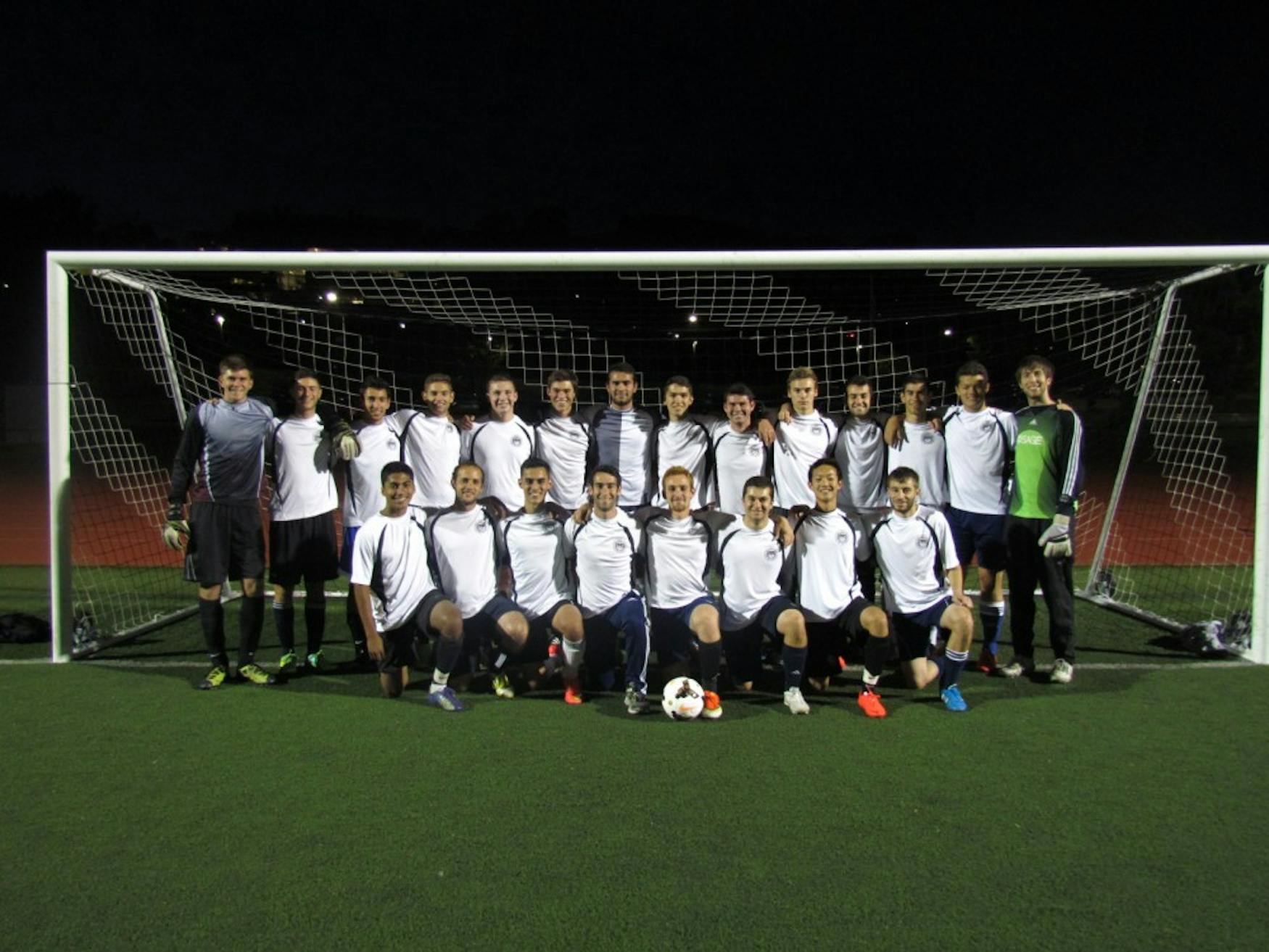 STRIKING A POSE: Members of the club soccer team Brandeis F.C., which uses soccer as an avenue for community service, sit for a team photograph on Gordon Field. Editor’s note: Sam Mintz ‘15 (front row, far right) is the deputy editor of the Justice.