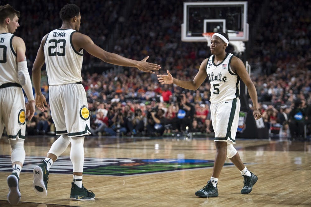 <p>Xavier Tillman (23) high fives Cassius Winston (5) during the second half of the NCAA Final Four game against Texas Tech at U.S. Bank Stadium in Minneapolis on April 6, 2019. The Spartans lost to the Red Raiders 61-51.  (Nic Antaya/The State News)</p>