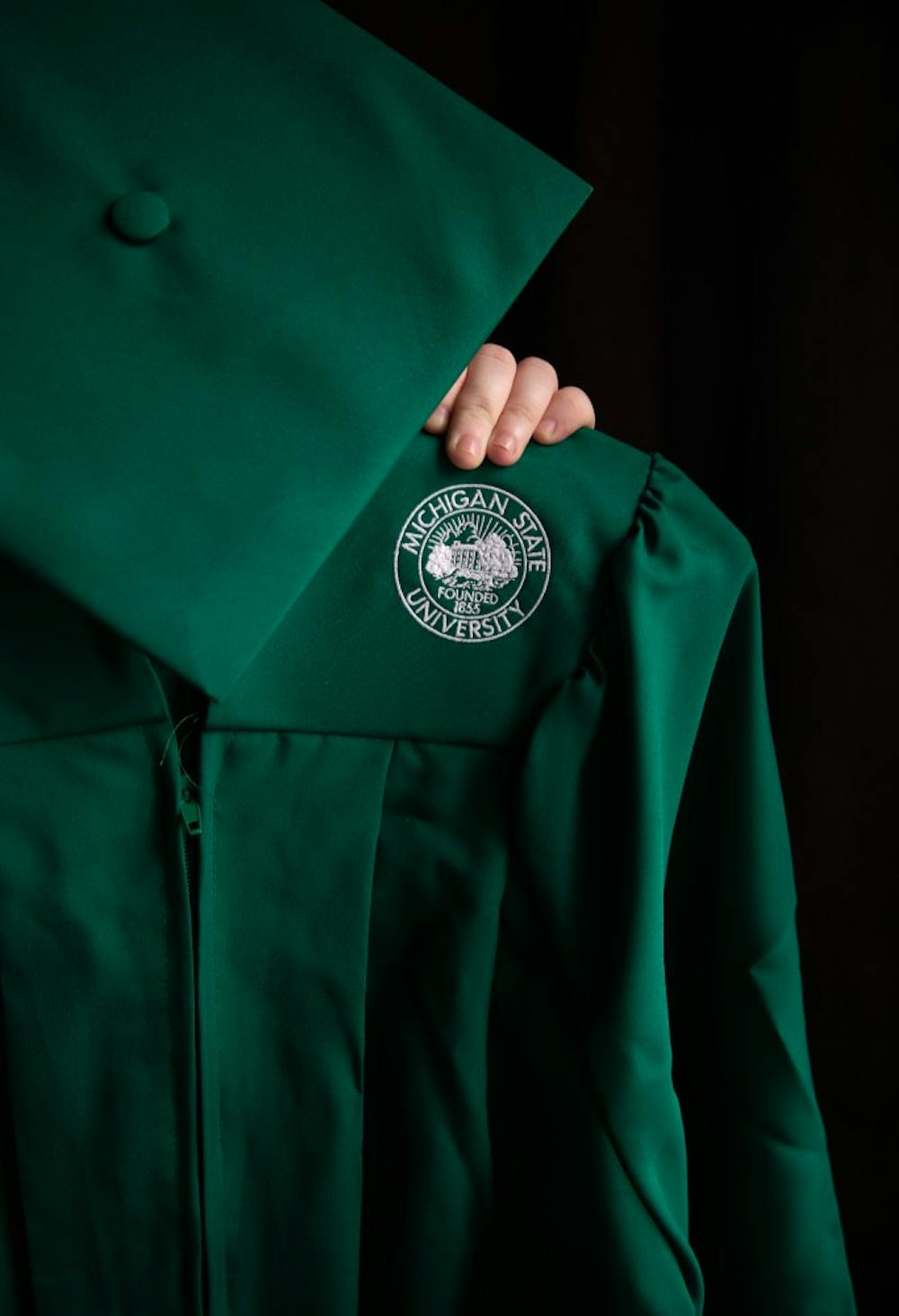 A graduation cap and gown photographed on April 22, 2020.