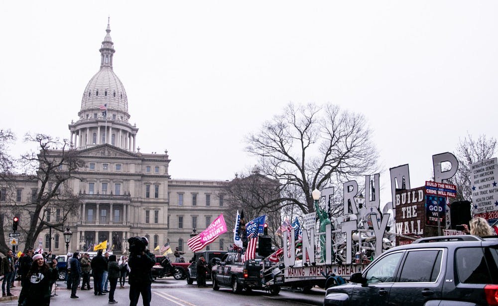 A "Trump Unity" trailer drives up to the Capitol at the Operation Gridlock protest April 15, 2020 in Lansing.