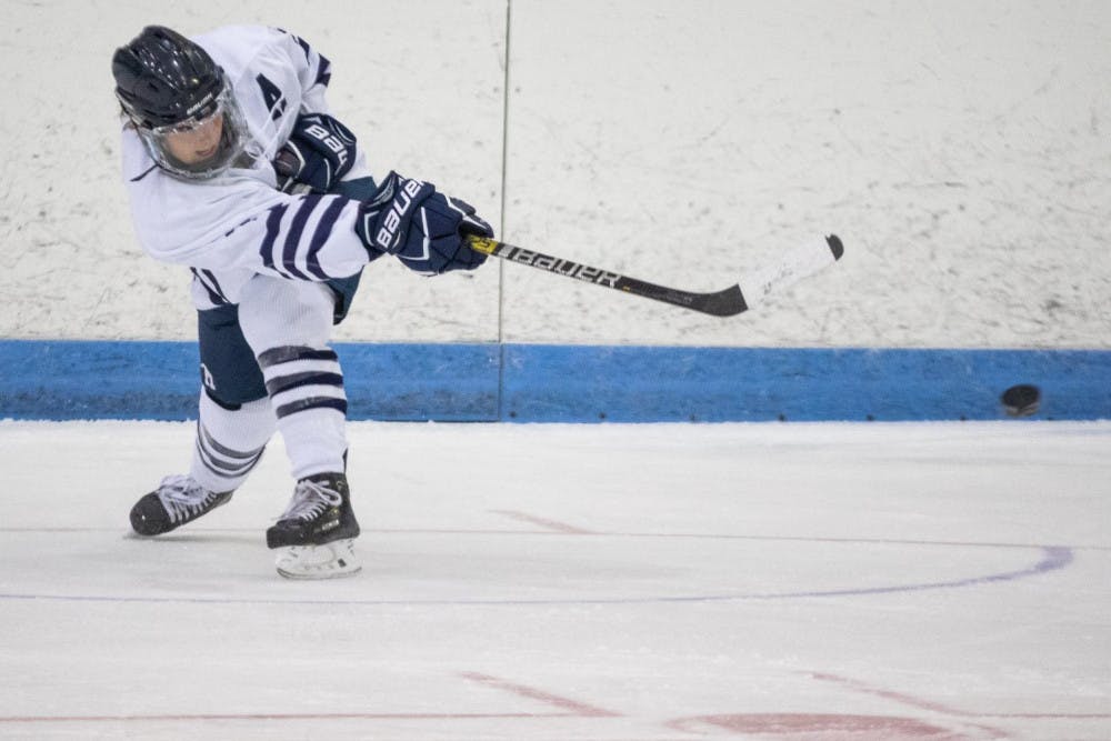 <span class="photocreditinline"><a href="https://middleburycampus.com/39670/uncategorized/michael-borenstein/">MICHAEL BORENSTEIN</a></span><br />Senior captain Jenna Marotta brings fire to the ice rink with her goal in the final 37 seconds in the NESCAC quarterfinals against Connecticut College.