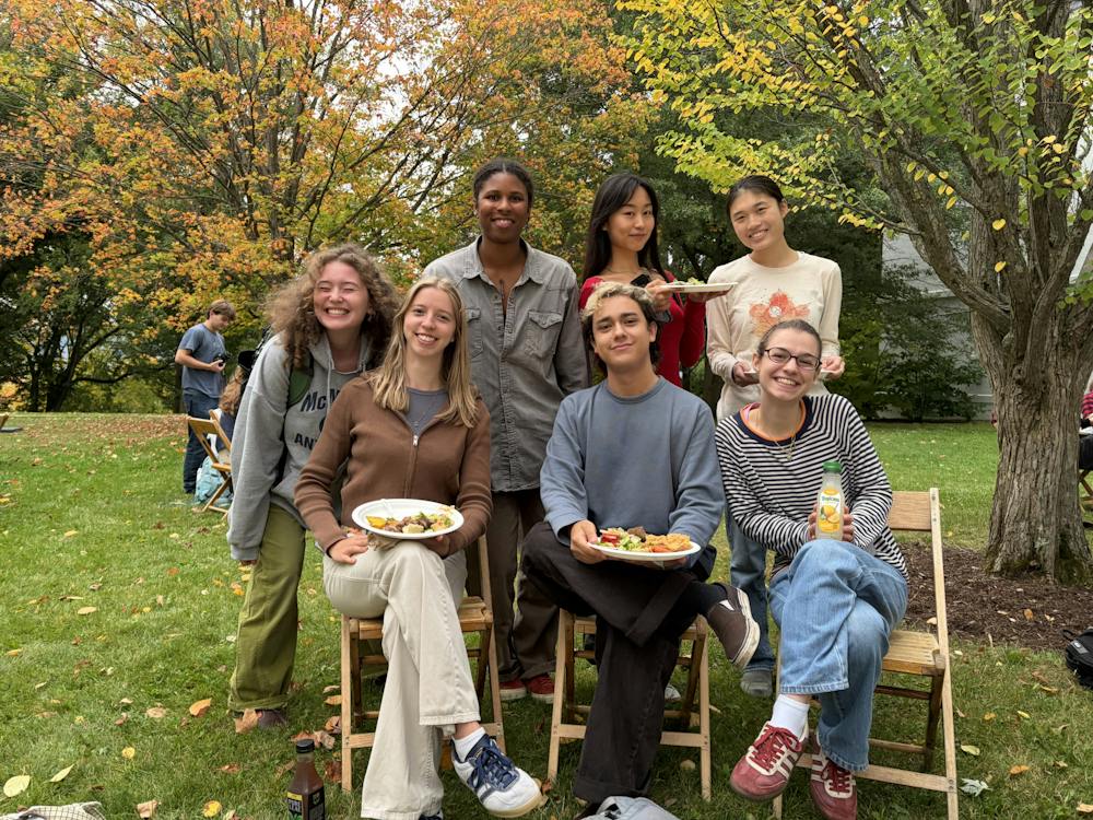 From left to right: Brooklin Dillard ’27, Claire Emanuel ’27, Myrah Valmyr ’27, Z Yang ’27, Devan Perez ’27, Sofi Gribovski ’27 and Anna Xie ’27 pose for a photo while enjoying their dinner.