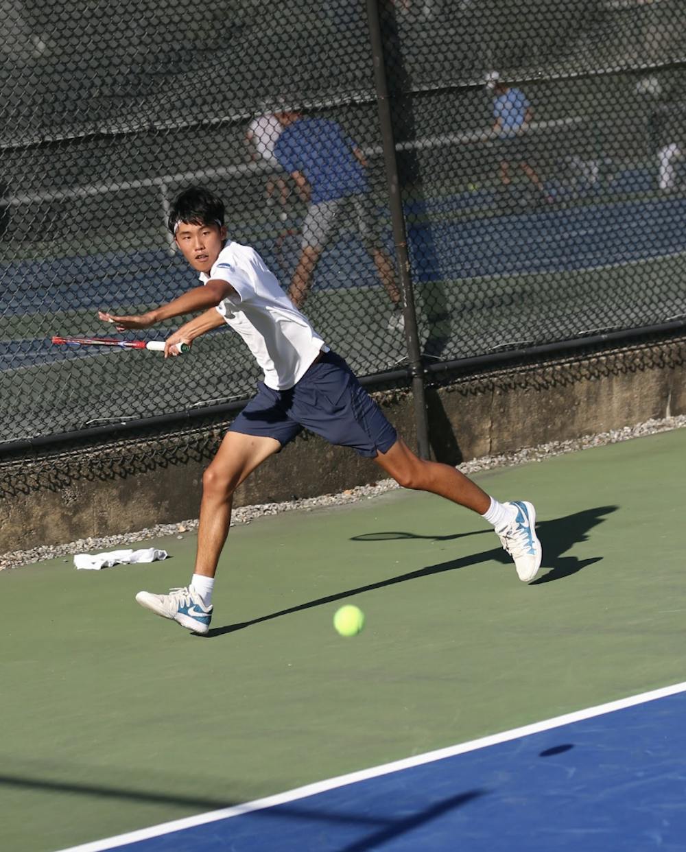 Julian “Juju” Wu ’26 lunges for the ball at the Middlebury Invitational, where he was crowned singles champion.