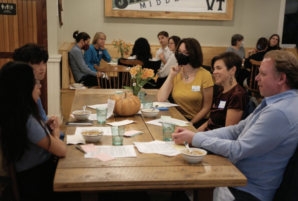 <p>Students, staff and faculty meet for a Conflict Transformation Experiential Learning reflection dinner at Shiretown Marketplace in October 2023.</p>