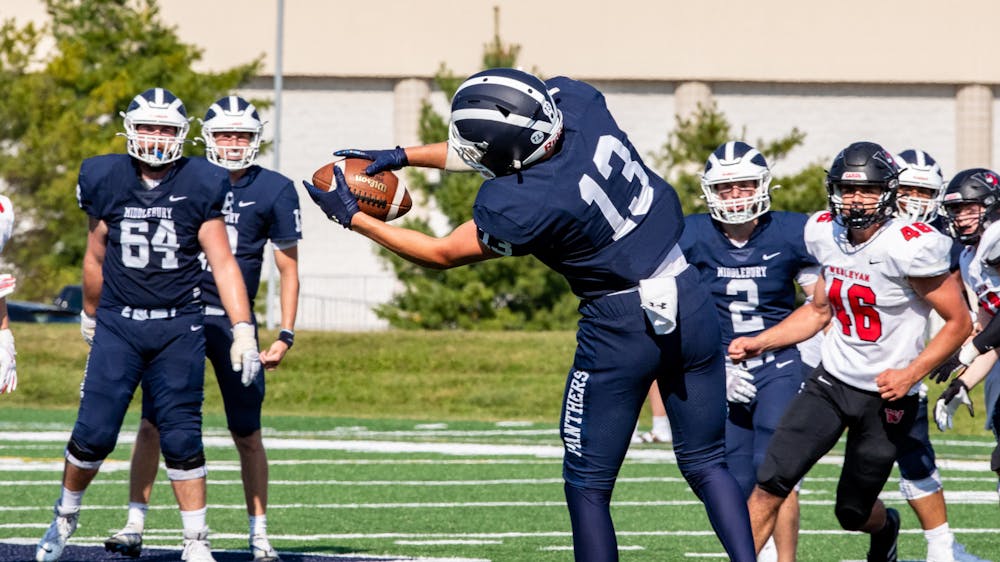 Ethan Vashel ’25 catches a pass in the football team’s season opener loss to Wesleyan.