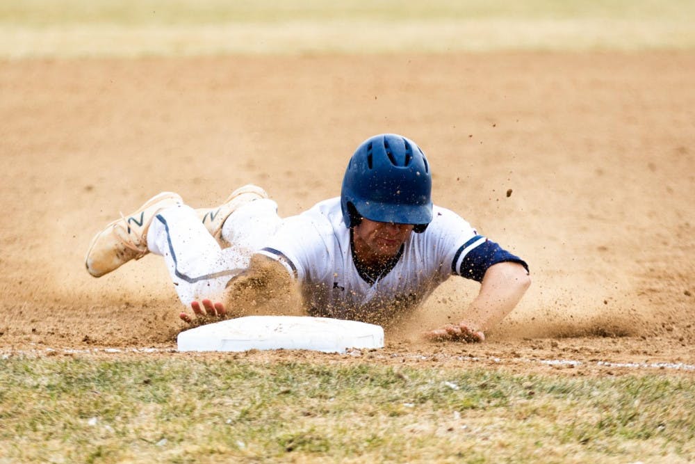 <span class="photocreditinline"><a href="https://middleburycampus.com/39670/uncategorized/michael-borenstein/">MICHAEL BORENSTEIN</a></span><br />Brooks Carroll ’20 slides into third base during the April 7 game against Plymouth State University.