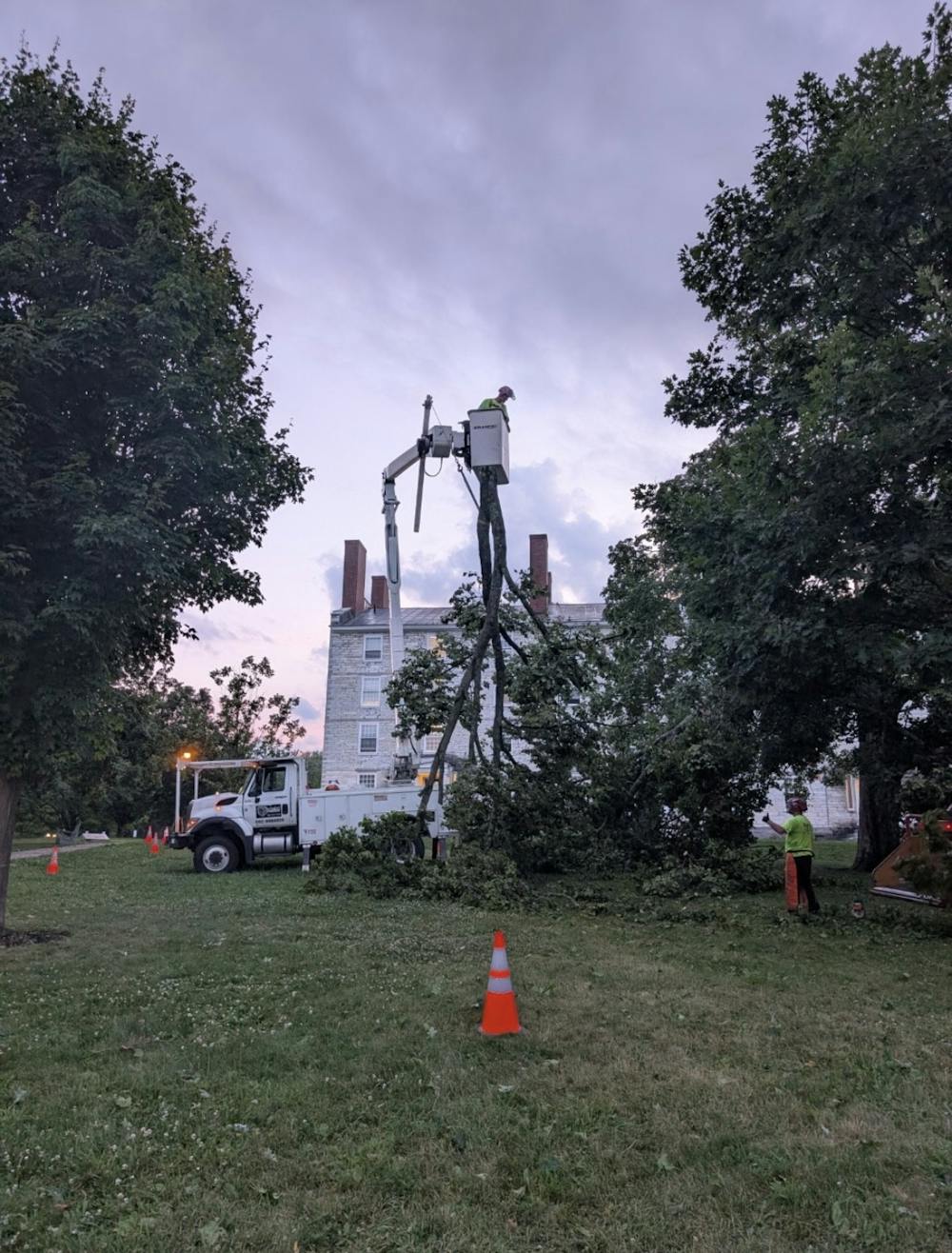 Middlebury staff removes storm damage on campus. 