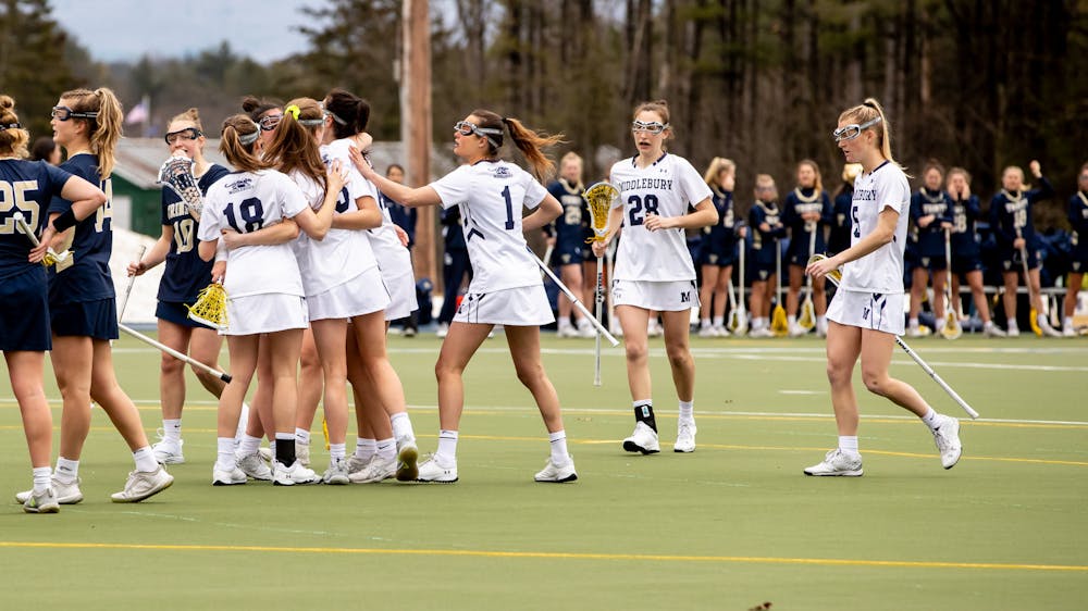 The Middlebury women’s lacrosse team celebrates a victory during their 2022 NCAA Championship season