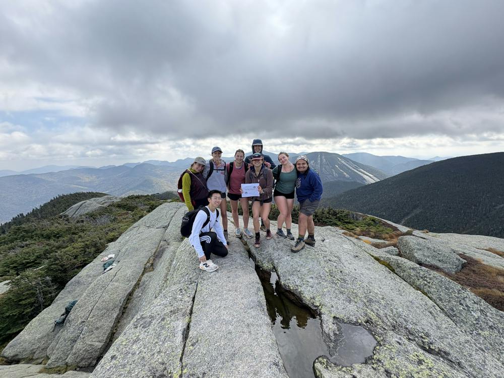 Middlebury hikers celebrate cresting one of the Adirondacks’ 46 High Peaks.