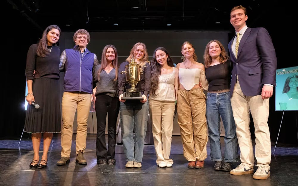 2026 finalists, alongside emcee’s Sarina Chitakara ’25.5 (left), and Reed Hyde ’28 (right).