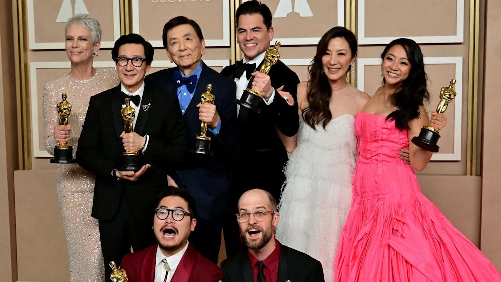 Cast members from “Everything Everywhere All At Once” celebrate with their awards.