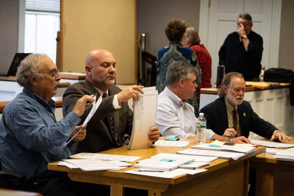 <span class="photocreditinline">MICHAEL BORENSTEIN /THE MIDDLEBURY CAMPUS</span><br />Volunteers recounting ballots for the state’s attorney race.