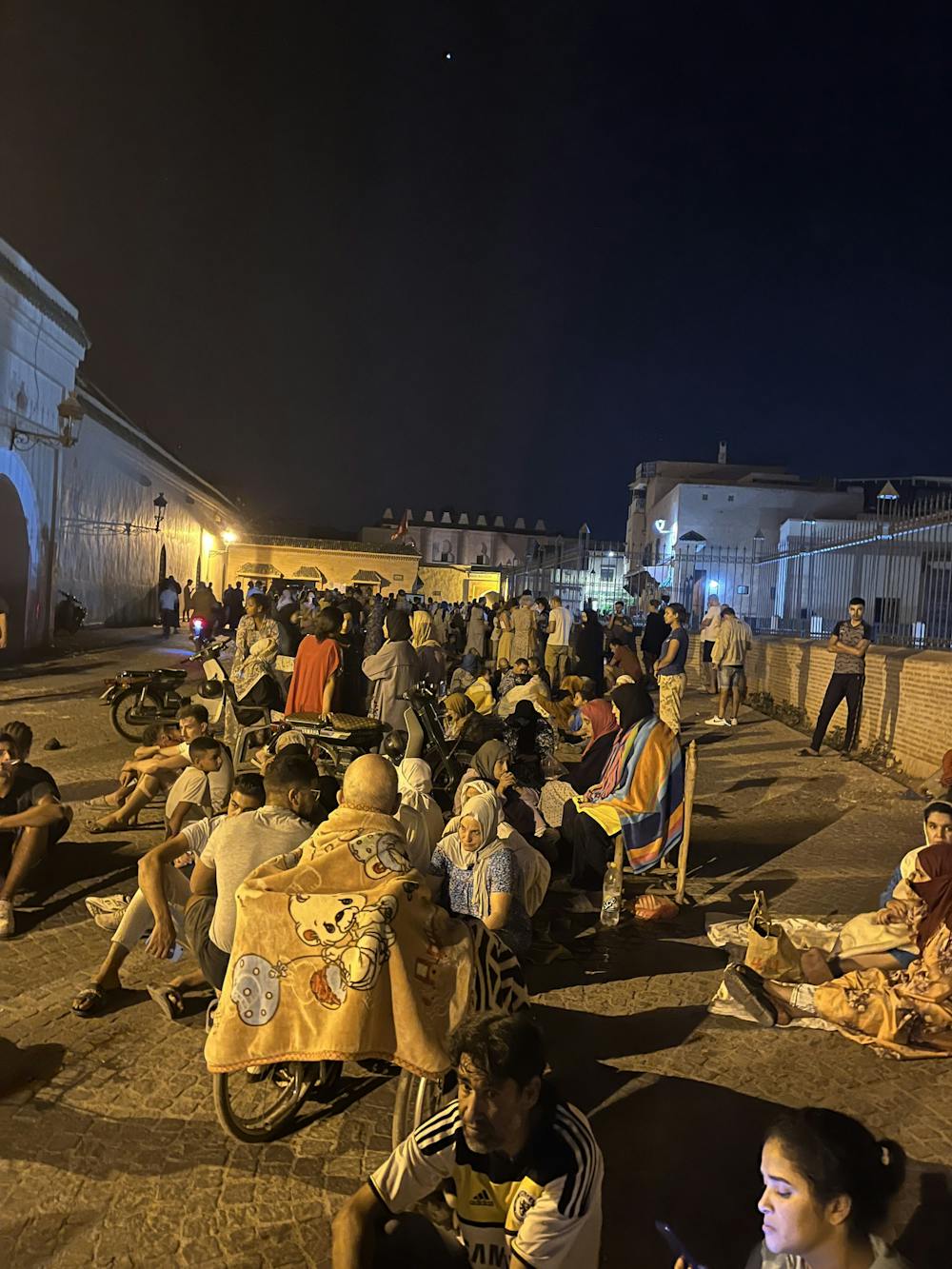 People seek refuge the square in front of Ibn Yusuf Mosque in the old city of Marrakech, Morocco after a 6.8 magnitude earthquake hit on Sept. 8.