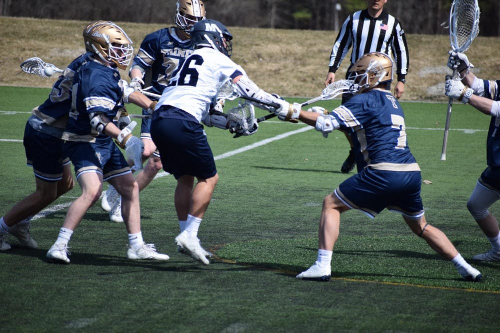 <span class="photocreditinline"><a href="https://middleburycampus.com/39367/uncategorized/benjy-renton/">BENJY RENTON</a></span><br />A.J. Kucinski ’20 had three assists and four goals in the game against Trinity on Saturday, April 13.
