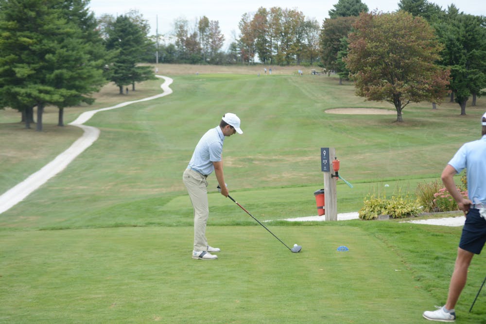 Charlie Schulman ‘26 lines up his tee shot on the 9th hole.