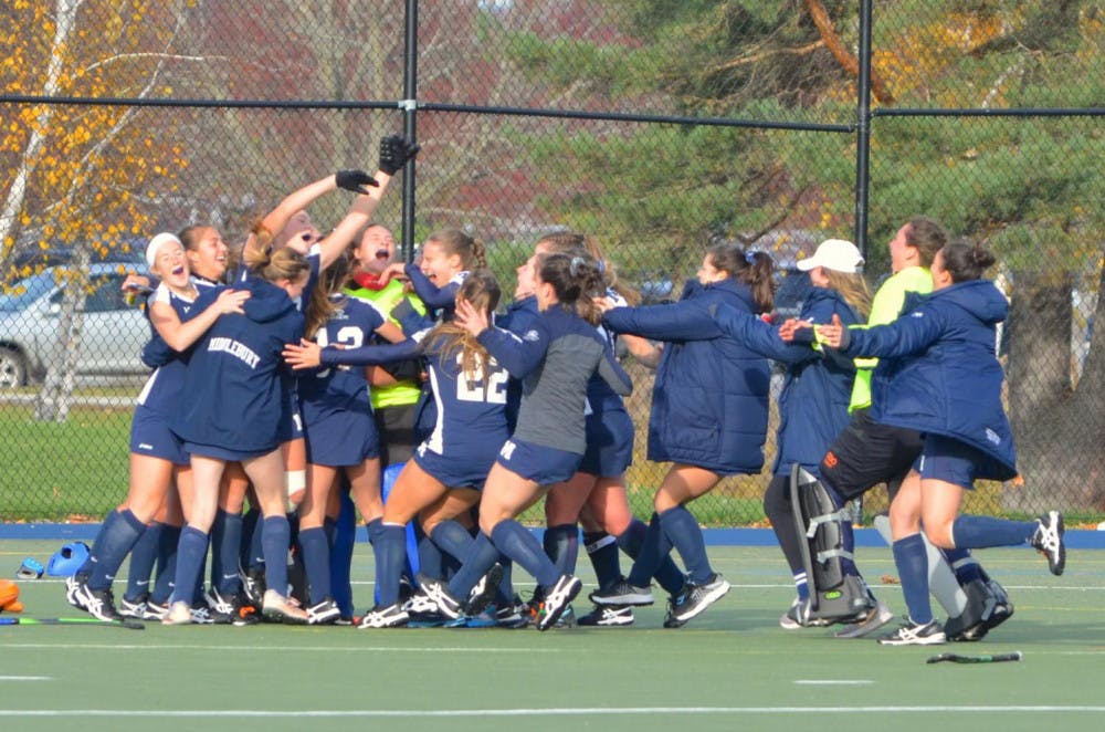 <span class="photocreditinline"><a href="https://middleburycampus.com/39367/uncategorized/benjy-renton/">BENJY RENTON</a></span><br />The field hockey team celebrates after defeating Tufts 1-0 in the NESCAC Championship on November 4. The Panthers defeated the Jumbos for the third time this season in the NCAA Division III Final.
