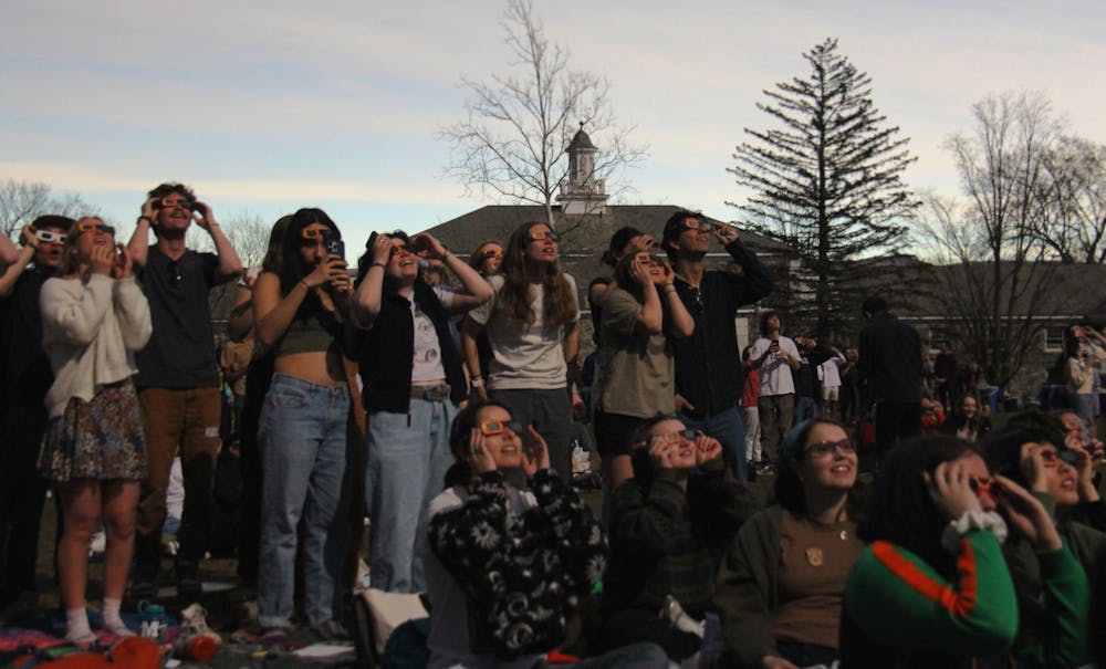 Students gathered on Battell Beach to observe the eclipse totality, which occurred for about one minute at 3:27p.m. in Middlebury.