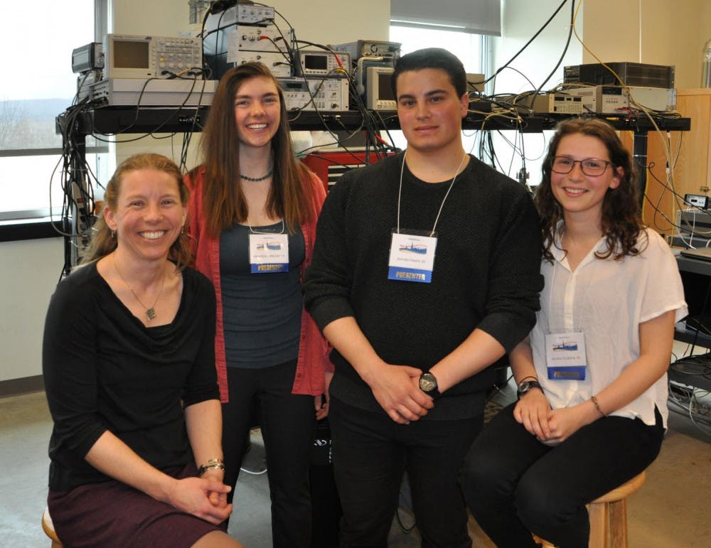 <span class="photocreditinline">COURTESY PHOTO</span><br />Professor of Physics Anne Goodsell, Amanda Kirkeby ’19, David Cohen ’20 and Sasha Clarick ’19 reconvened at the laser cooling lab after presenting at the Student Spring Symposium.