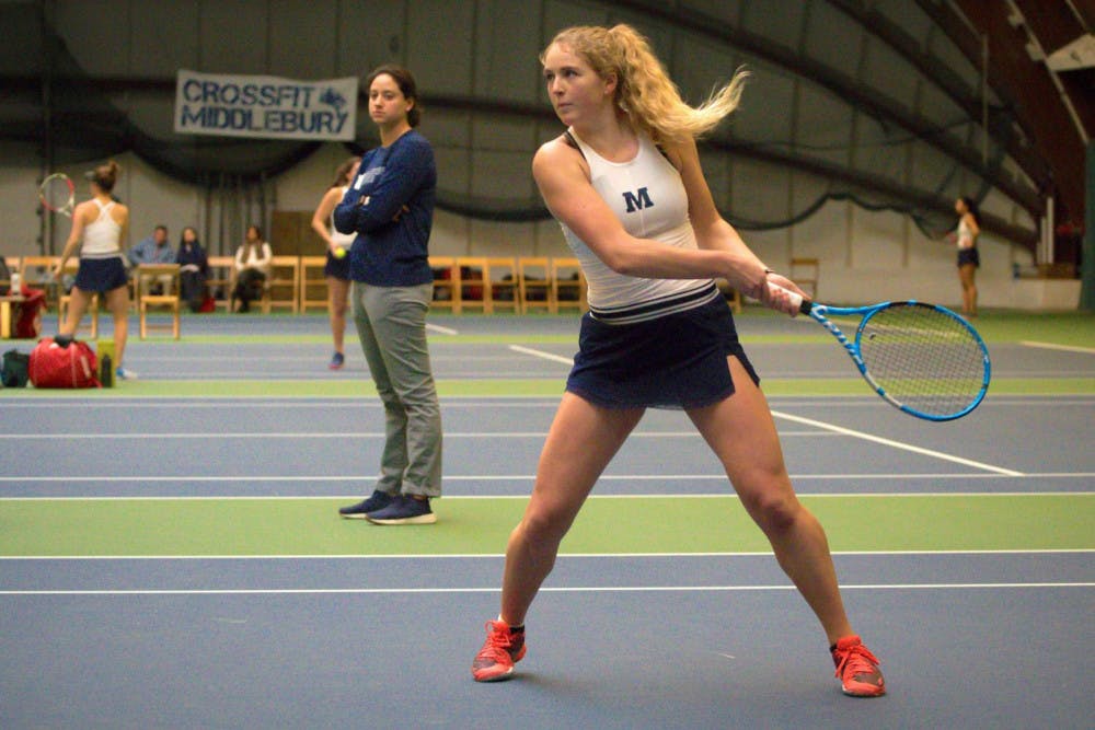 <span class="photocreditinline"><a href="https://middleburycampus.com/39670/uncategorized/michael-borenstein/">Michael Borenstein</a></span><br />Junior Skylar Schossberger dishes out a backhand in a doubles match.