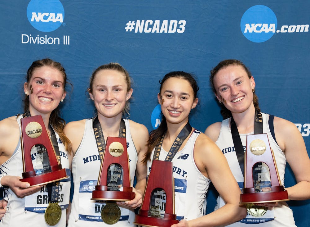 The women’s distance medley relay team poses after their sixth place finish.