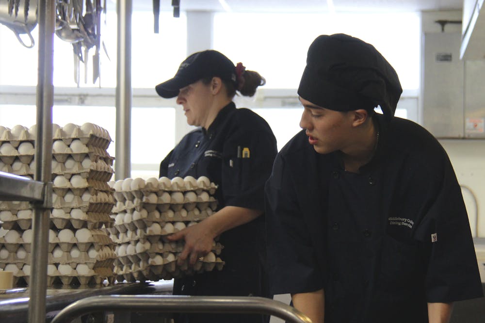 Dining Services staff in Proctor Dining Hall unloads carton after carton of eggs to prepare an early morning breakfast for students.