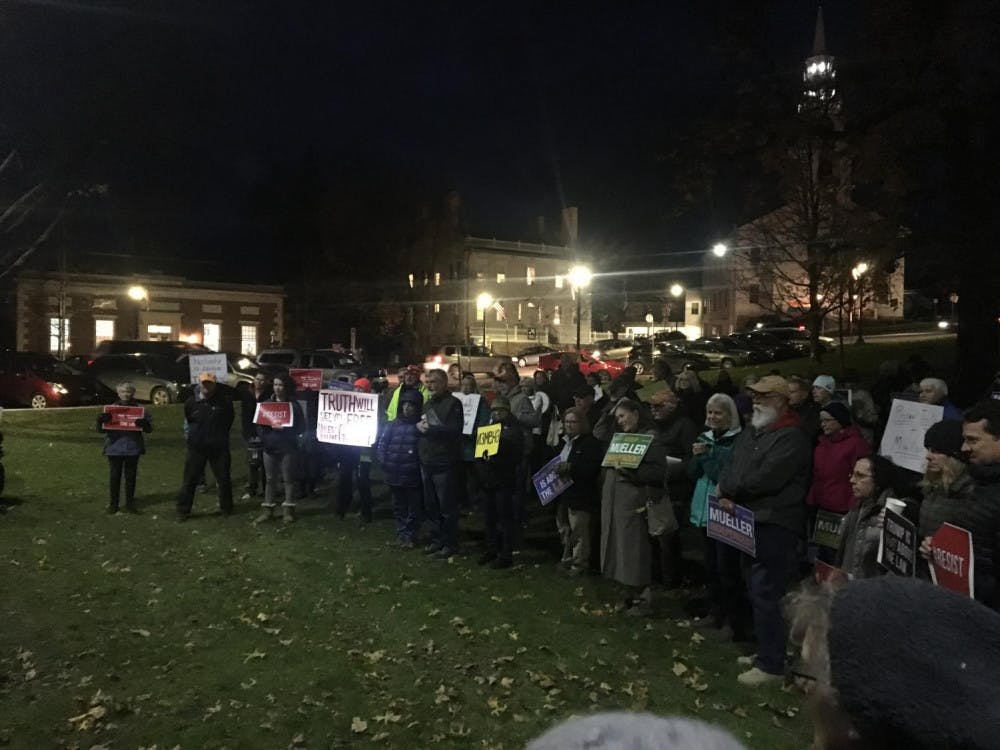 Protestors gathered on the town green in Middlebury Thursday evening in support of Special Counsel Robert Mueller’s investigation into Russian collusion in the 2016 presidential election.