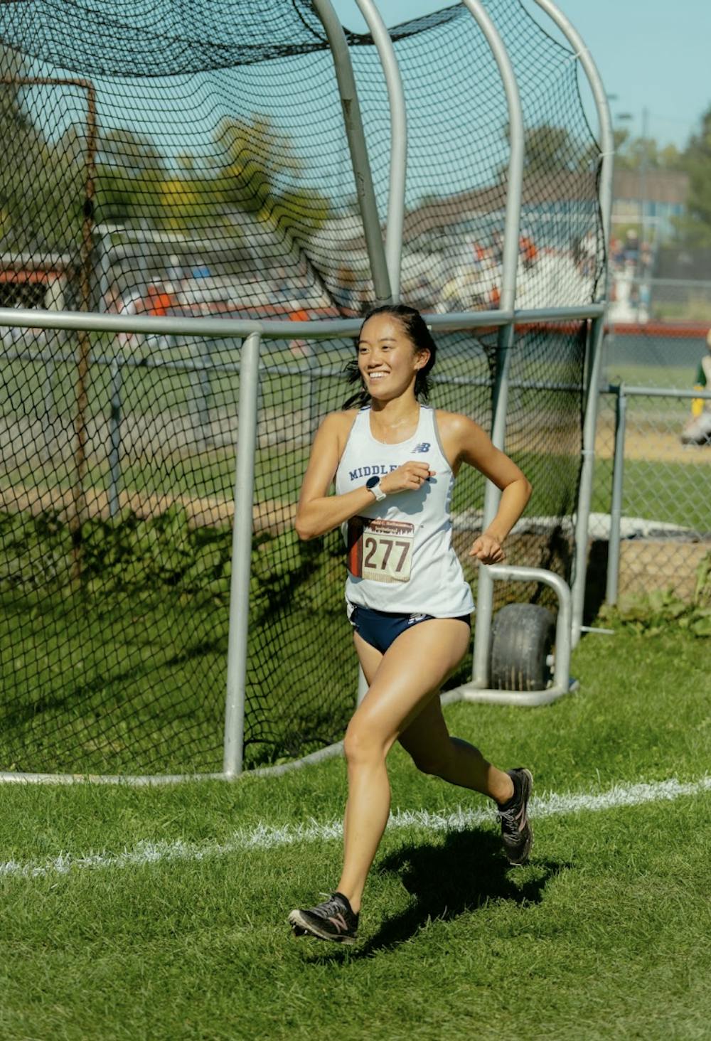 <p>Winnie Wang ’24 is all smiles during her 6k race.</p>