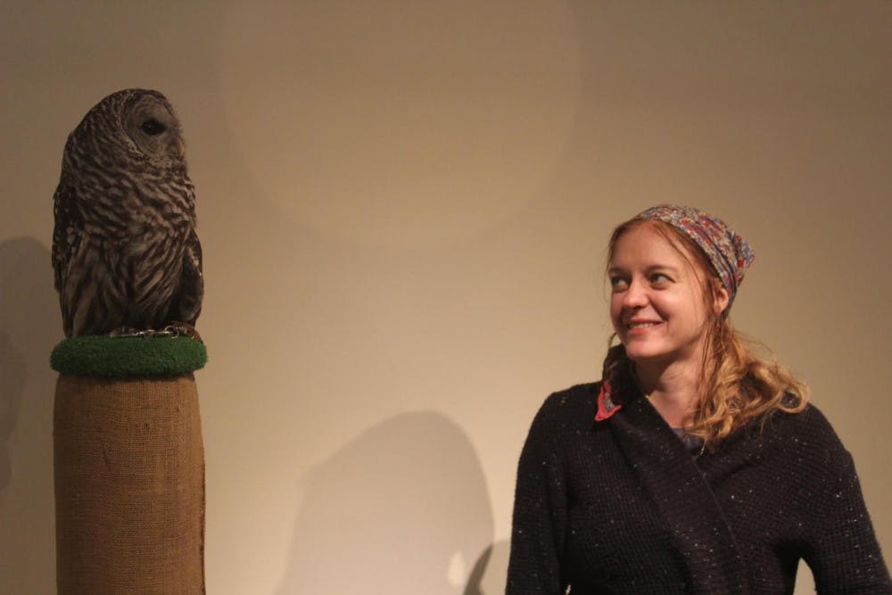 <span class="photocreditinline"><a href="https://middleburycampus.com/35897/uncategorized/nick-garber/">NICK GARBER</a></span><br />Outdoor educators Marcia (left) and Mark Wilson show off a barred owl at the fourth annual Owl Festival at the Vermont Institute of Natural Science in Quechee on Saturday, Feb. 23.