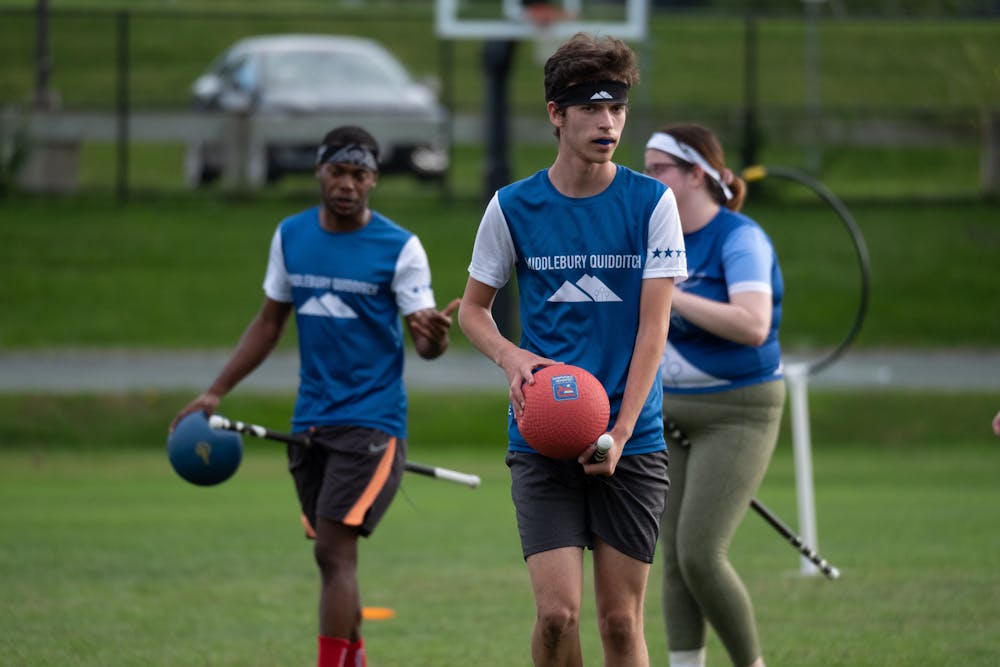 Matthew Silverman ’22 leads Middlebury’s Quidditch team against Brown University during a fall contest. COURTESY OF TOM GREEN.