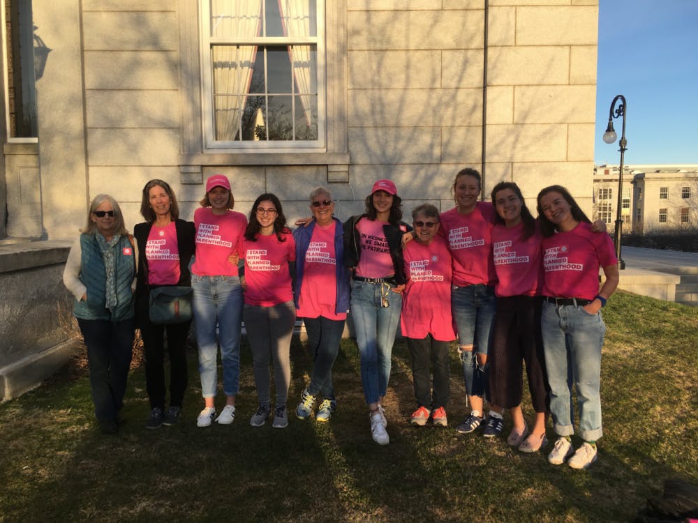 <span class="photocreditinline">Paige Feeser</span><br />Middlebury students and activists stand with Planned Parenthood at the Statehouse in Montpelier.