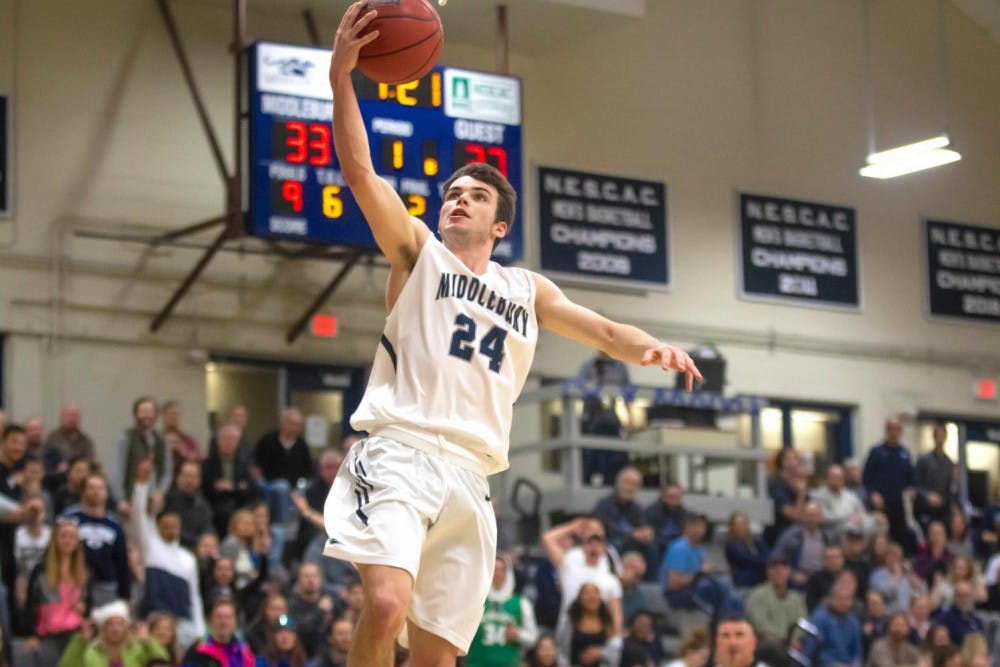 <span class="photocreditinline"><a href="https://middleburycampus.com/39670/uncategorized/michael-borenstein/">MICHAEL BORENSTEIN</a></span><br />Jack Farrell ’21 finds his way to the hoop in the NESCAC quarterfinal against Tufts.