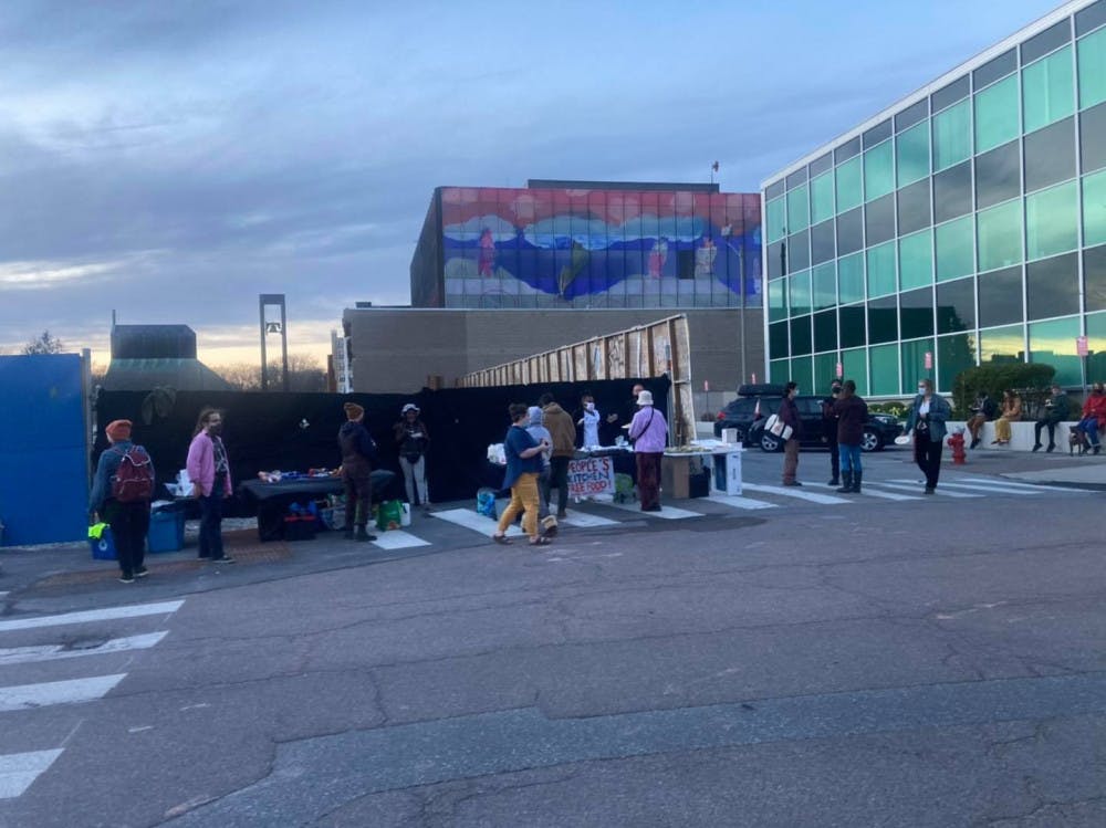 <span class="photocreditinline">Courtesy of People’s Kitchen’s Facebook page</span><br />Pictured above is an event held by People’s Kitchen in downtown Burlington on May 2 in which free food was distributed to community members.