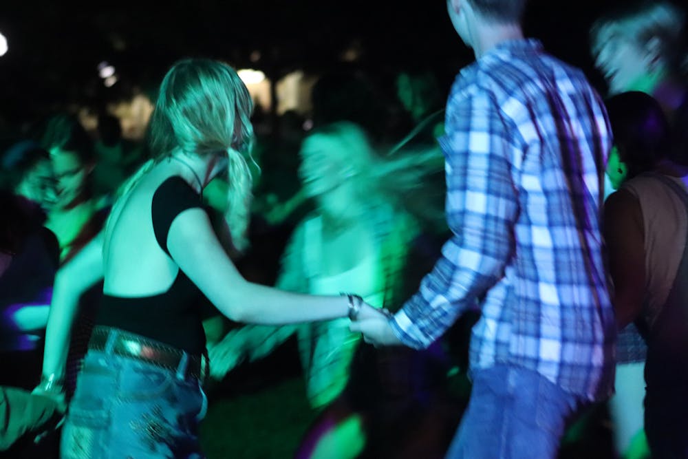 <p>New students participate in square dancing, a popular orientation event.</p>