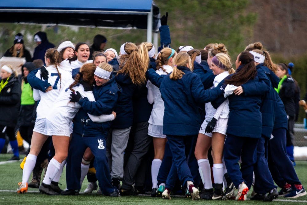 <span class="photocreditinline"><a href="https://middleburycampus.com/39670/uncategorized/michael-borenstein/">MICHAEL BORENSTEIN</a></span><br />The women's soccer team celebrates after advancing to the Final Four on November 18.