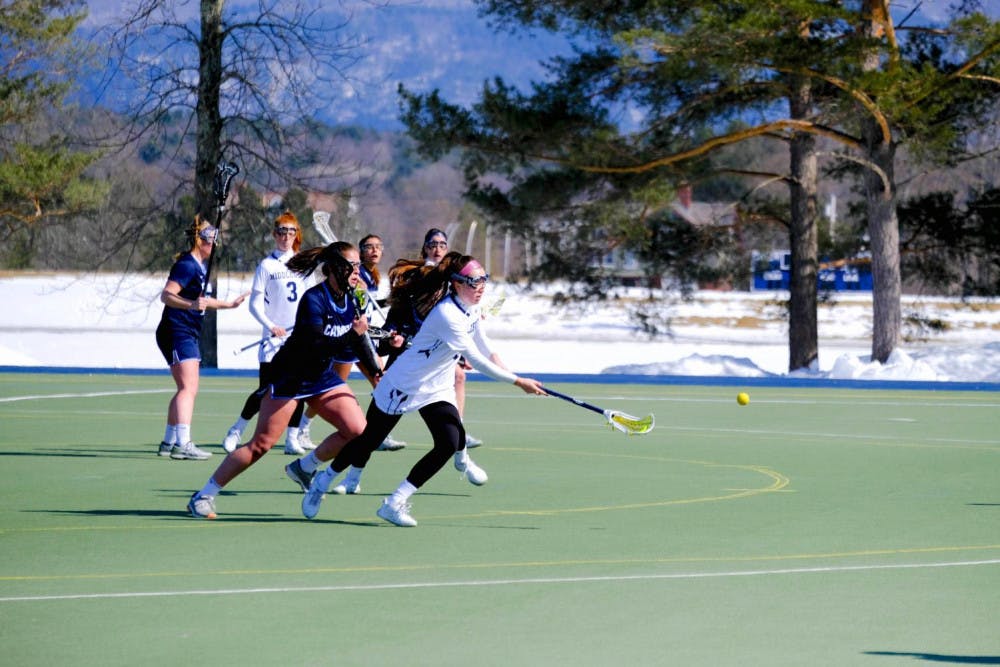 <span class="photocreditinline">Shirley Mao</span><br />Madeline Riordan ’22 protects the ball against a Connecticut College defender.