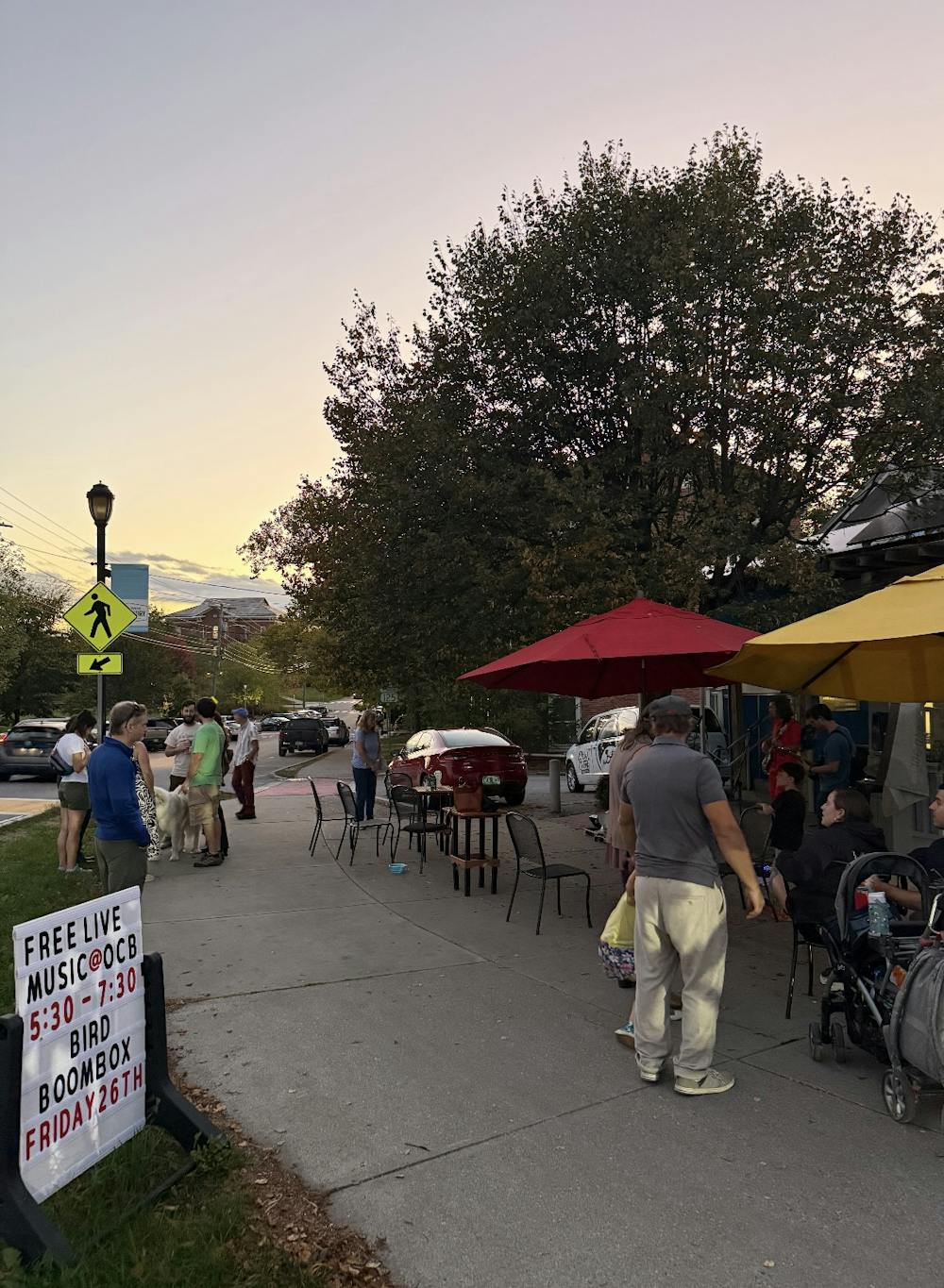 Band Bird Boombox performs on the sidewalk in front of Otter Creek Bakery.