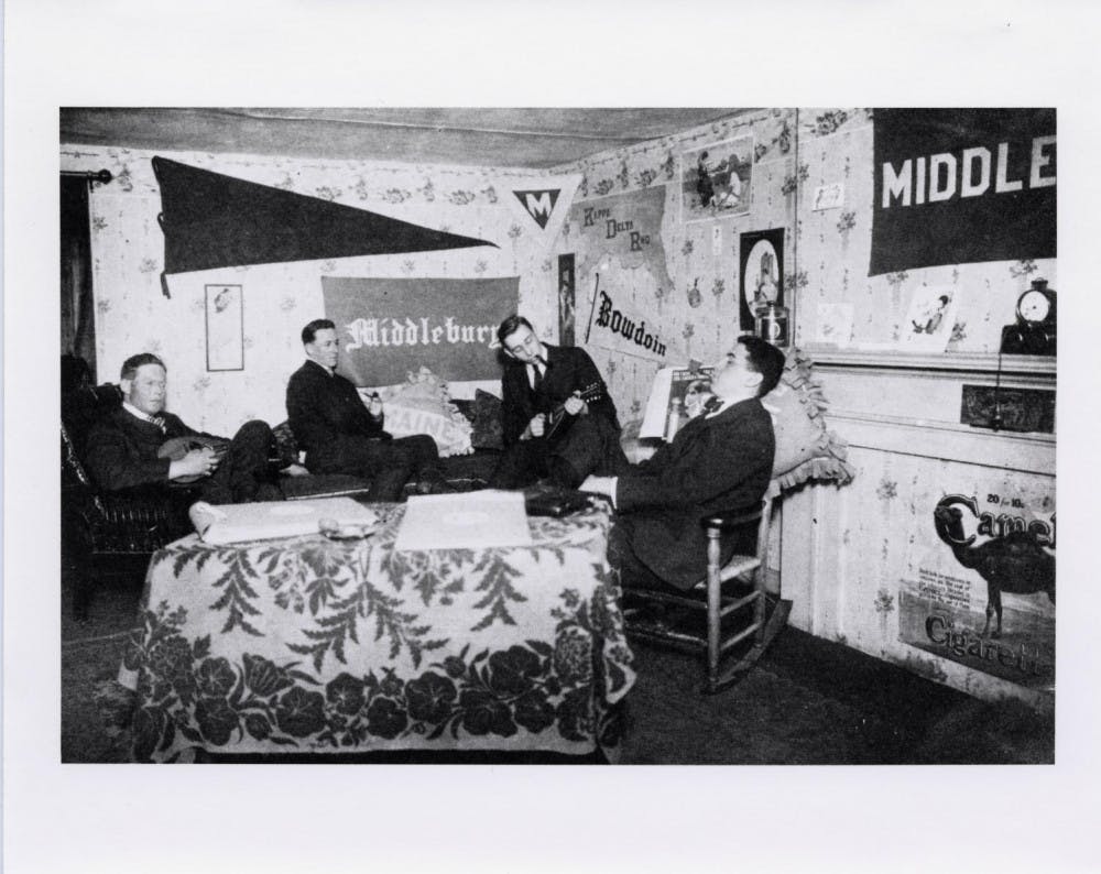 <span class="photocreditinline">COURTESY OF SPECIAL COLLECTIONS</span><br />Four students sit in a dorm room in 1918.