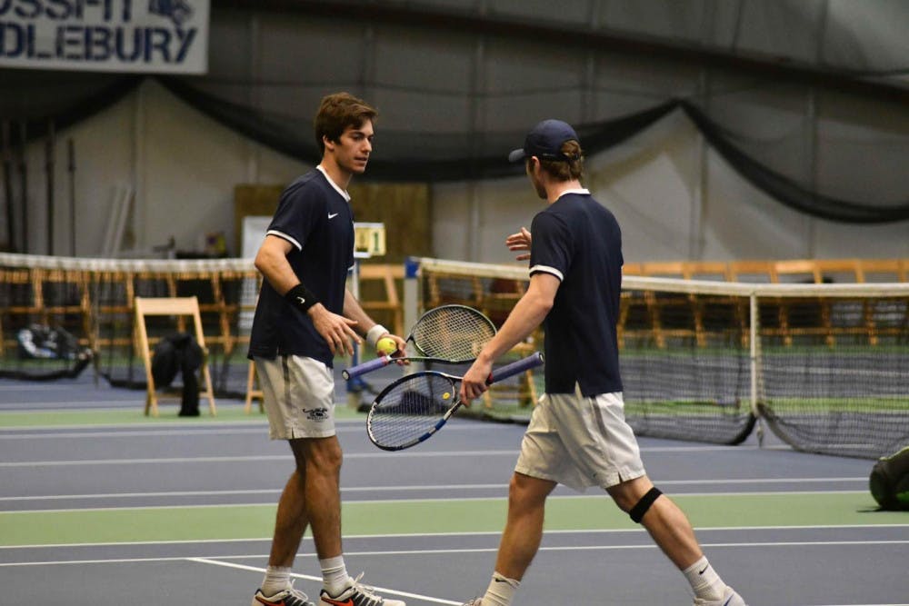 <span class="photocreditinline"><a href="https://middleburycampus.com/43248/uncategorized/max-padilla/">Max Padilla</a></span><br />Doubles partners Alex Vanezis ’20 and Peter Martin ’19 high-five after taking the lead.