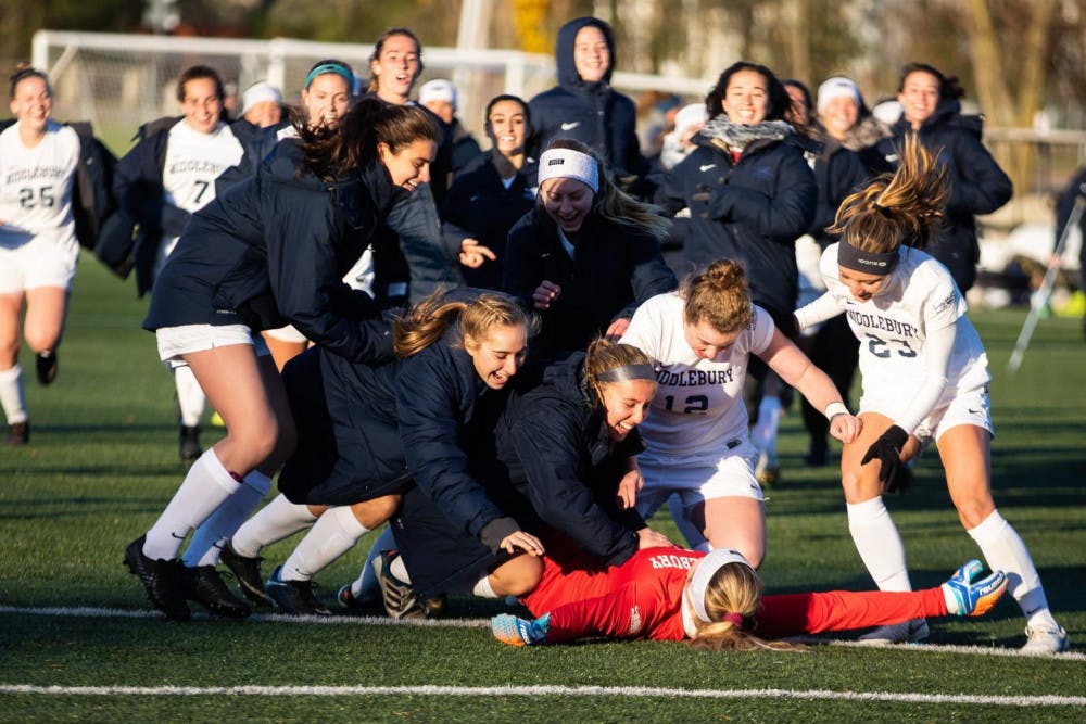 <span class="photocreditinline"><a href="https://middleburycampus.com/39670/uncategorized/michael-borenstein/">MICHAEL BORENSTEIN</a></span><br />The women’s soccer team celebrates after claiming the NCAA regional title last year.
