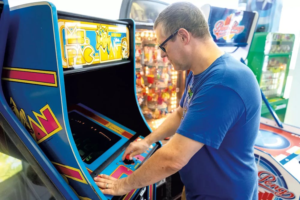 <p>Owner Christian Bloom plays Ms. Pacman, Retro Realm’s oldest game.</p>