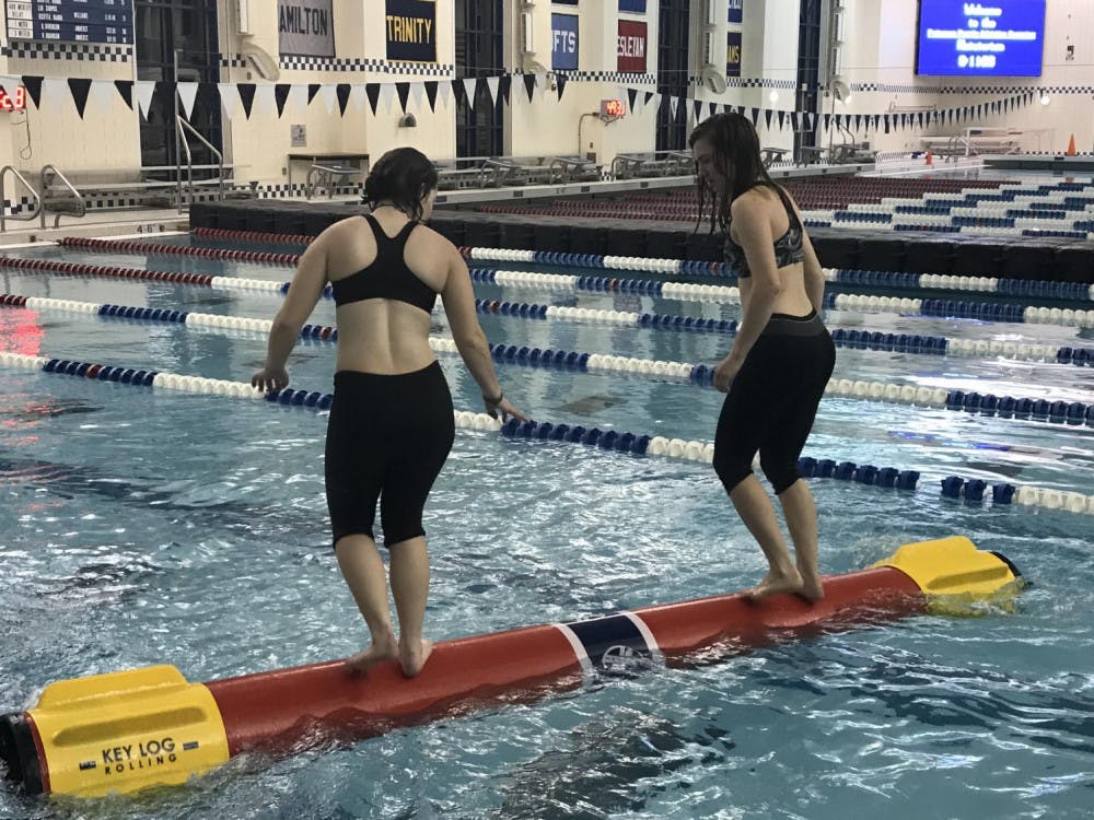 <span class="photocreditinline"><a href="https://middleburycampus.com/39414/uncategorized/erin-kelly/">Erin Kelly</a></span><br />Chloe Fleischer ’21.5 practices rolling against a teammate during practice in preparation for the tournament.