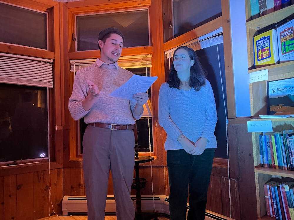 <p>Organizers Arthur Martins &#x27;23.5 and Lucia Snyderman &#x27;23.5 take the stage for the New England Review&#x27;s Student Poetry Reading Night. </p>