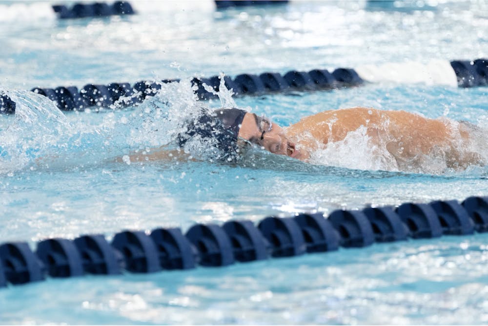 David Porges ’25 zips through the water in the 1000m freestyle event at a home meet against Amherst.