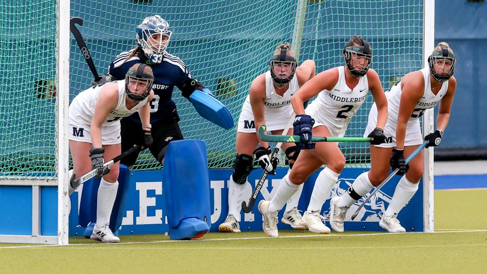 Middlebury field hockey defense prepares for a penalty corner.