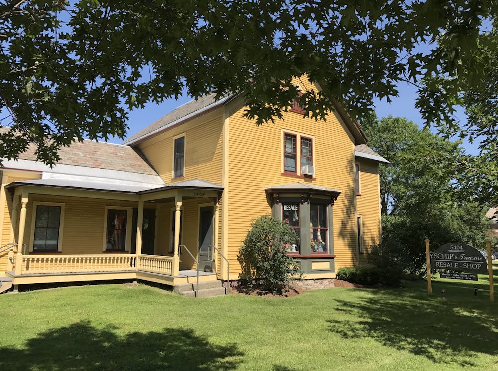 The two-story yellow house located along Highway 7 houses the SCHIP nonprofit resale store.