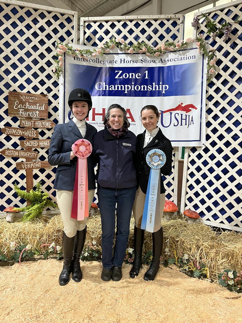 Middlebury equestrian team riders Anika Jessup ’23 and Sage Mauri ’23 with coach Kate Selby at the Zone 1 Championship.