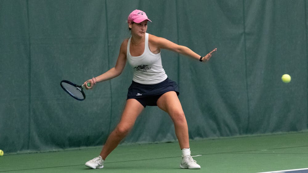 Nathalie van der Reis ’25 hits a forehand during women’s tennis’s 7–2 win over Emory.