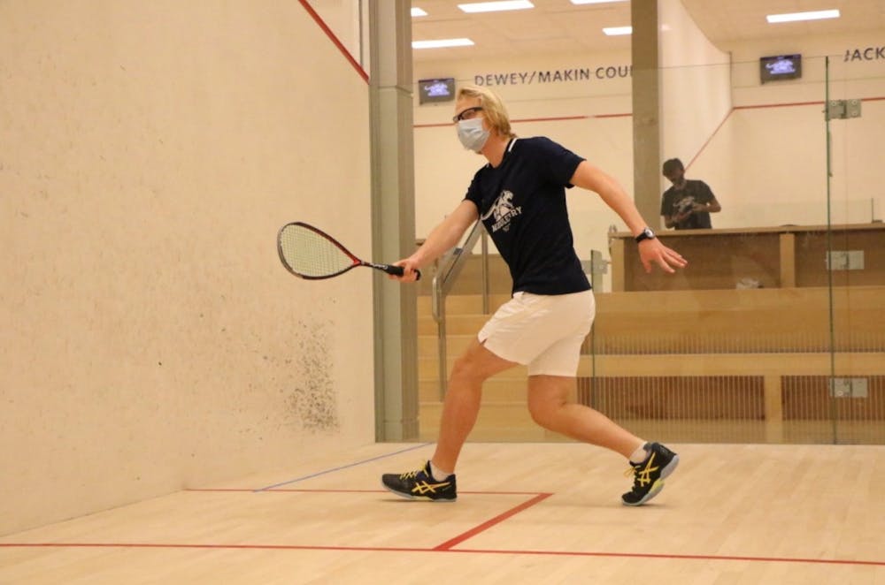Teddy Best ’22, co-captain of men’s squash, stands at the top of the team’s lineup. Courtesy of Will Costello