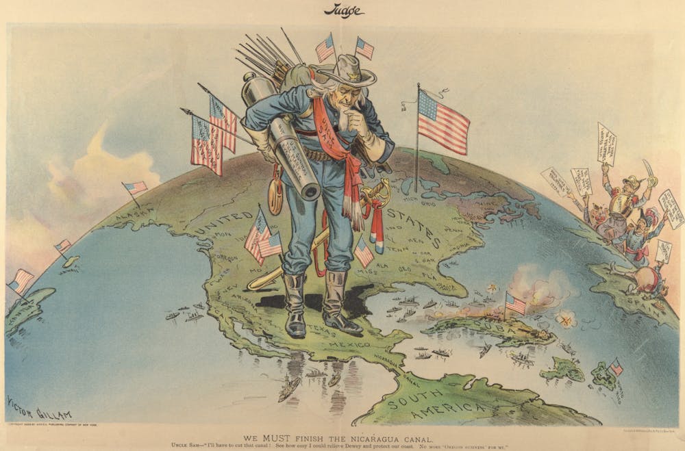 A cartoon from Judge Magazine, at the height of American expansionism, showing U.S. interests (marked by American flags) from The Philippines, Hawaii and Alaska to Cuba