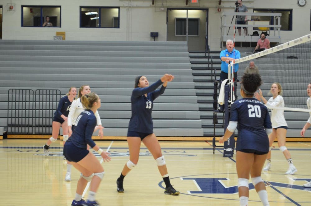 <span class="photocreditinline"><a href="https://middleburycampus.com/39367/uncategorized/benjy-renton/">BENJY RENTON</a></span><br />Sarah Staver ’19 passes the ball as the women’s volleyball team covers her during their victorious match against Trinity on Sept. 15. The Panthers won both of their matches this past weekend.